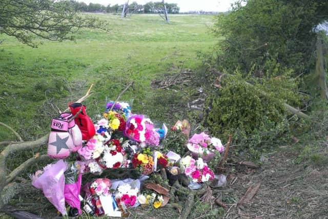 Flowers left at the scene of the crash in tribute to Karl Bennett.