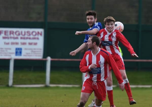 Seaham Red Star Reserves (red/white) battle against Wearside League rivals Richmond Town in the Monkwearmouth Cup last week. Picture by Kevin Brady