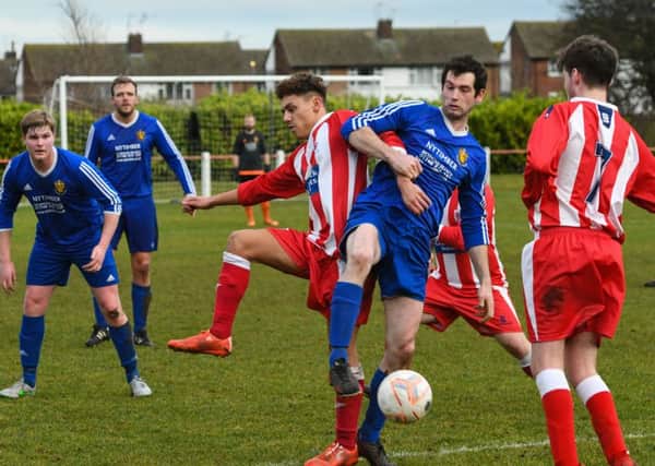 Seaham Red Star Reserves (red/white) take on Wearside League rivals Richmond Town in the Monkwearmouth Cup last week. Picture by Kevin Brady