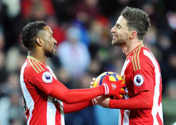 Fabio Borini debates who should take the late penalty against Liverpool with Jermain Defoe. Picture by FRANK REID