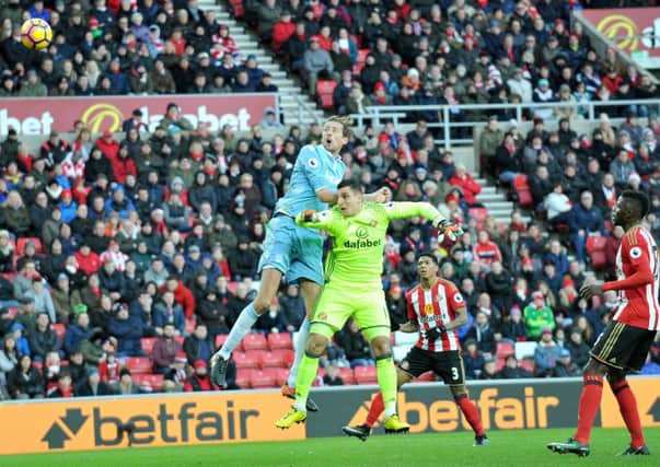 Peter Crouch beats Vito Mannone to head home Stoke's third goal against Sunderland. Picture by Frank Reid