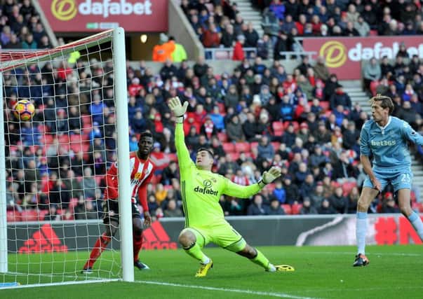 Sunderland keeper Vito Mannone can only watch despairingly as Stoke's opening goal hits the back of the net. Picture by Frank Reid