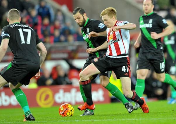 Goalscorer Duncan Watmore takes on Erik Pieters and Ryan Shawcross in last season's 2-0 Sunderland win at home to Stoke. Picture by Frank Reid