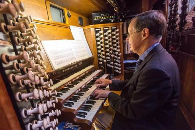 James Lancelot, performing on the organ.