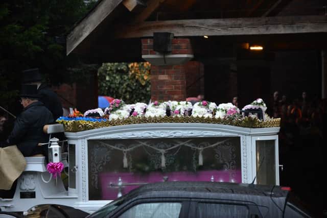 Amber Rose Cliff is lifted from the carriage and into Sunderland Crematorium.