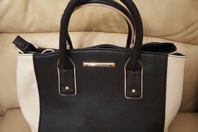 The money was stolen from this handbag after it was left on the Metro by a woman as she gathered up her shopping.