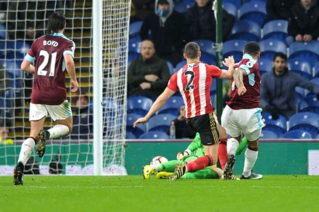 Andre Gray slides home the second