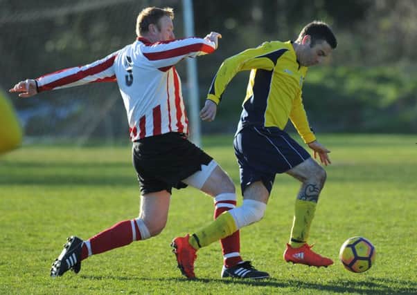Over-40s action: Durham County (yellow) take on Wearmouth Old Boys