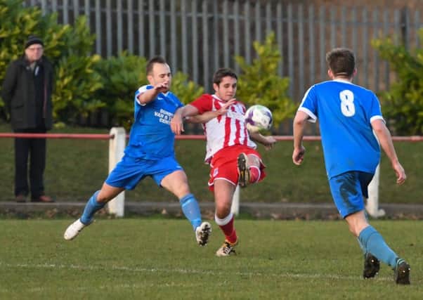 Seaham Red Star (red) fight it out against Dunston UTS last month