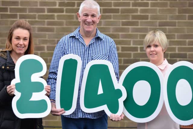Phil Brennan who has had cancer multiple time donates funds to Macmillian Cancer Care. Fundraising manager Jane Curry and wife Fern Brennan