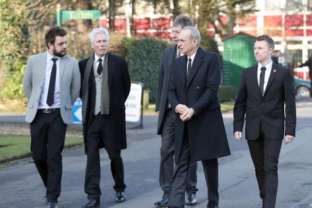 Status Quo members, from left, Leon Cave, Andy Bown, John 'Rhino' Edwards, Francis Rossi and Richie Malone arrive for the funeral of guitarist Rick Parfitt. Pic: PA.
