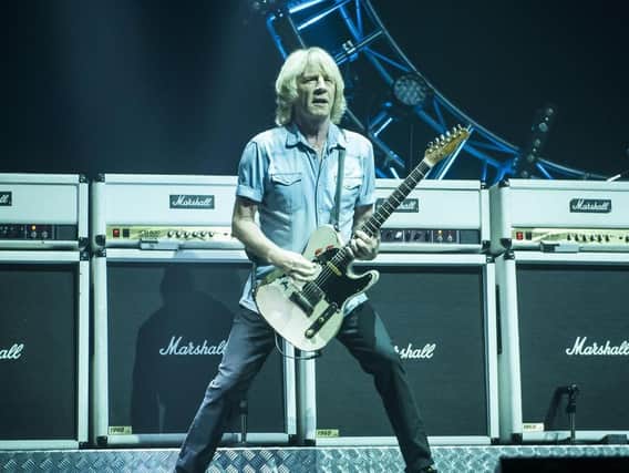 Rick Parfitt on stage with Status Quo. Pic: PA.