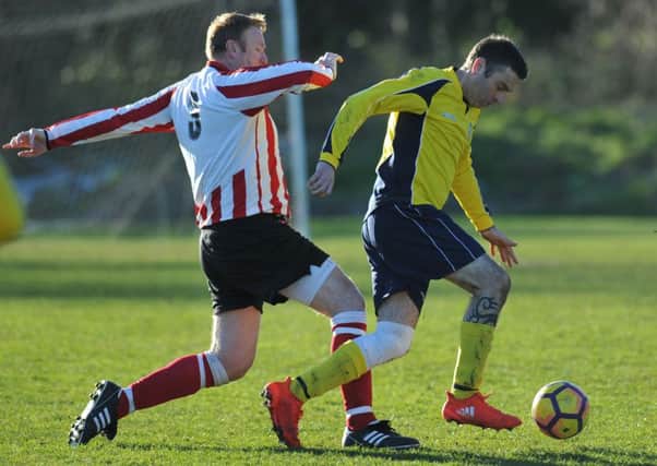 Durham County (yellow) battle Wearmouth Old Boys in the Over-40s League last week. Picture by Tim Richardson