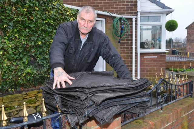 Douglas Soakell with coal bags recovered from the van