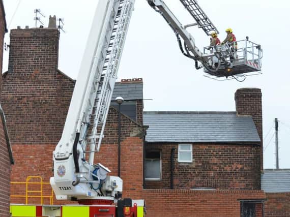 Firefighters at the scene of yesterday's blaze in Croft Avenue