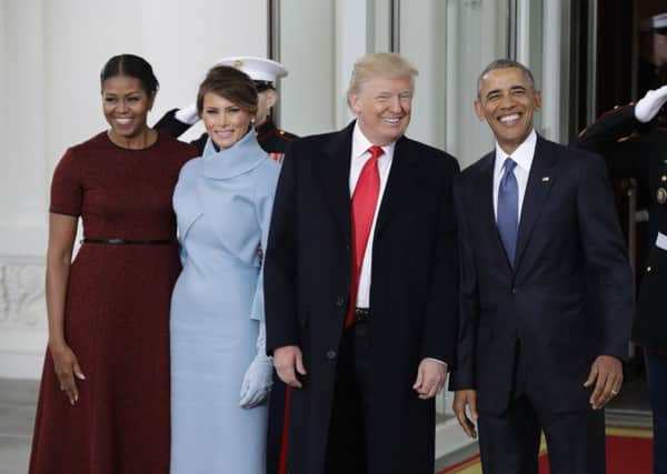Barack Obama stands with US president-elect Donald Trump, first lady Michelle Obama and Melania Trump at the White House (AP)