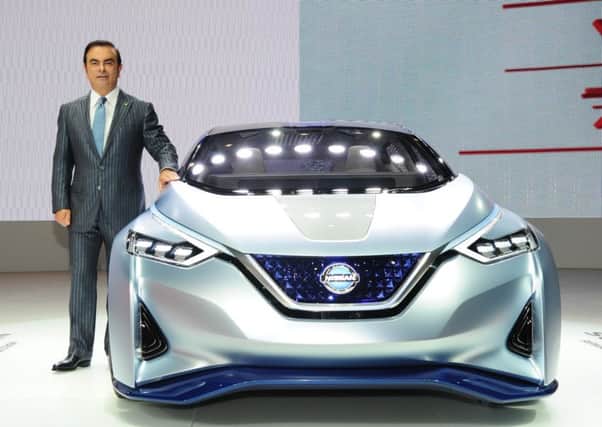 Nissan's Carlos Ghosn with the IDS concept car.