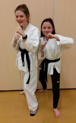 Eastlea Karate Club members Olivia Wilson and Ellie Stephenson.