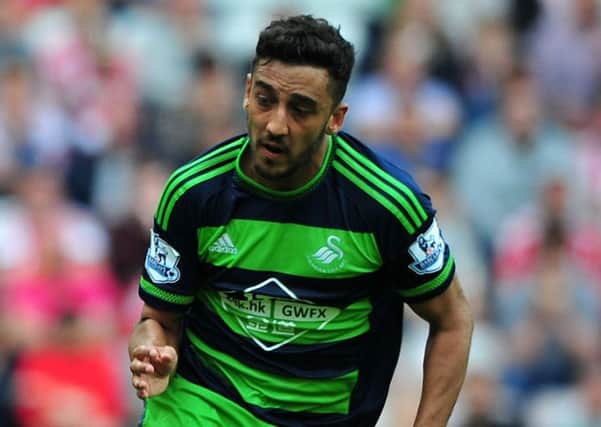 Neil Taylor in action for Swansea at the Stadium of Light last season. Picture by Frank Reid