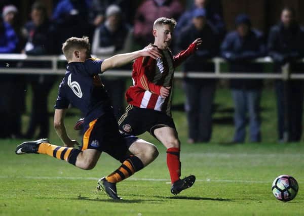 Owen Bailey slides a tackle in on Sunderland's Lee Connelly in tonight's FA Youth Cup tie.  Picture by Tom Banks