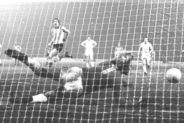 Manchester United keeper Gary Bailey dives to keep out John Hawley's penalty at Roker Park on Janaury 28, 1981