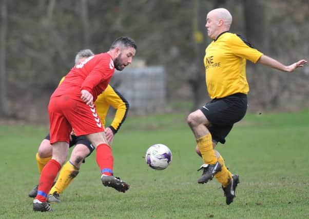 Wearmouth CW (red) attack against Penshaw Catholic Club in the Over-40s League last week. Picture by Tim Richardson