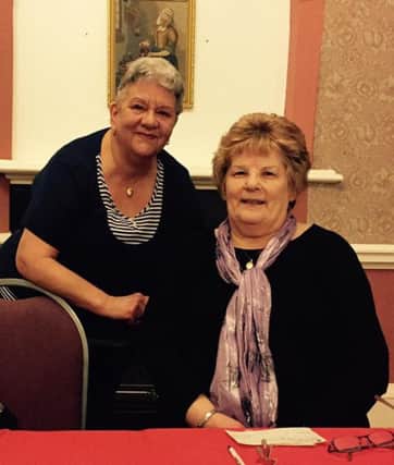 Jean Dixon, from Haswell Mencap, receives a cheque for the charity from Easington Village WI President Hazel Wynn.