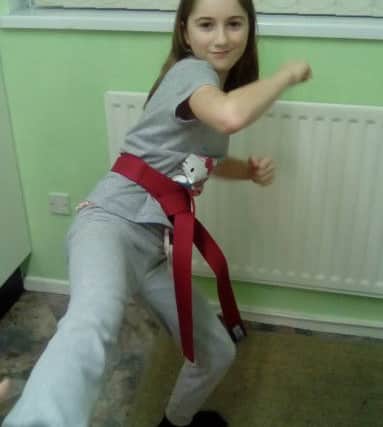 Rebekah Brennan, who has double graded to a red belt.