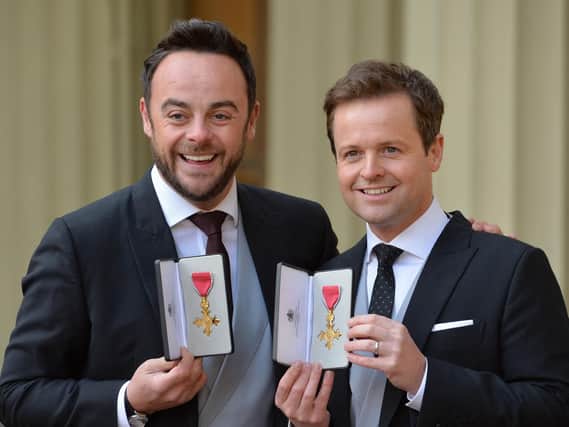 Ant and Dec reunited after being presented with their OBEs at Buckingham Palace. Pic: PA.