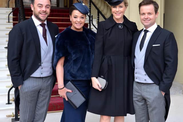 TV presenters Ant and Dec and their wives Lisa Armstrong and Ali Astall arrive at Buckingham Palace. Pic: PA.