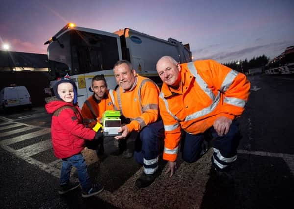 Jack Beswick with bin lorry driver Paul Hardy and loaders Keith Holden and Michael Plant.