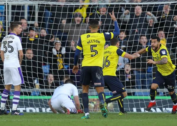 Sheer delight: Oxford United striker Kane Hemmings (right) celebrates putting his side ahead against the Magpies on Saturday. Picture by Gareth Williams/AHPIX.com