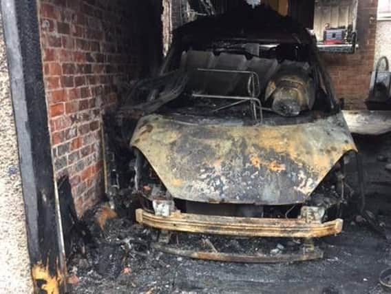 The car damaged in the blaze at the Roberts' home in Millfield.