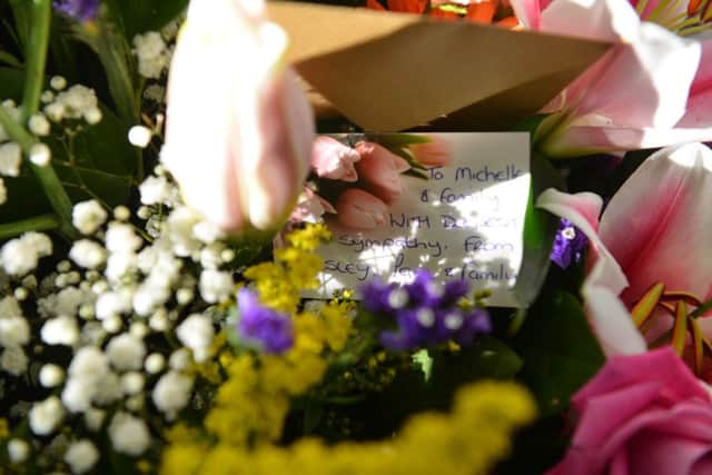 Floral tributes to Michael Doda.