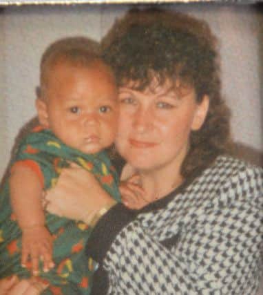 Michael Doda as a boy with mum Michelle.