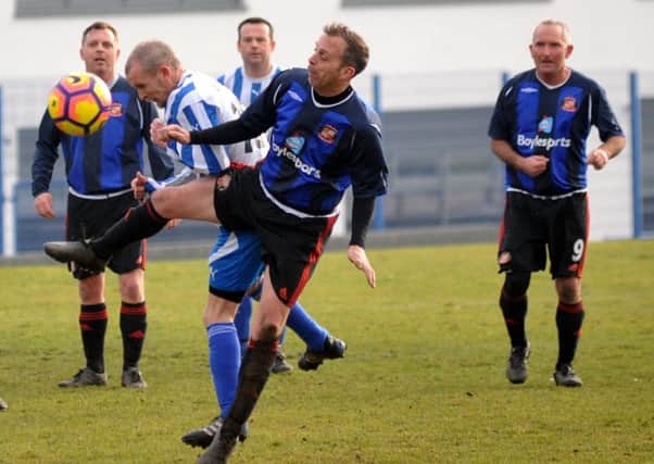 Mill View SC (dark blue) take on Milbourne Arms in the Over-40s League last week. Picture by Tim Richardson