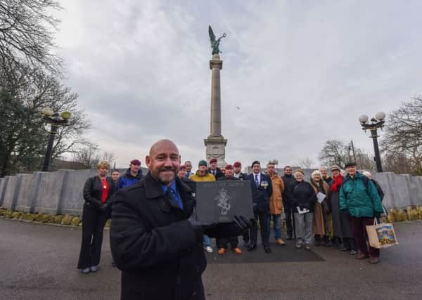 Tom Cuthbertson pictured with one of the commemorative stones at the Veterans' Walk