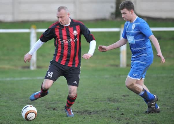 Ashbrooke Belford House (red and black) battle against Seaham Red Star Reserves in the Wearside League last week. Picture by Tim Richardson
