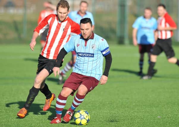 Sunday League Football action between Hendon Athletic (blue) v Lakeside, played at Silksworth Sports Complex, Sunderland.