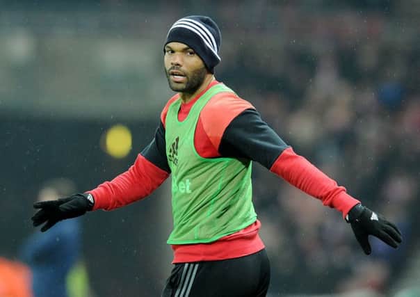 Joleon Lescott warms up during the Sunderland and Tottenham game on Tuesday night.