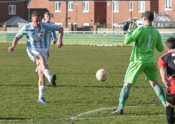Stephen Bogie hits home Ashbrooke Belford House's opening goal in Saturday's Durham County Trophy semi-final at Coxhoe Athletic. Picture by Kevin Brady