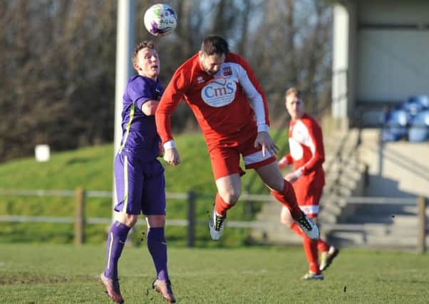 Washington (red) battle against Guisborough Town in Saturday's 0-0 draw. Picture by Tim Richardson