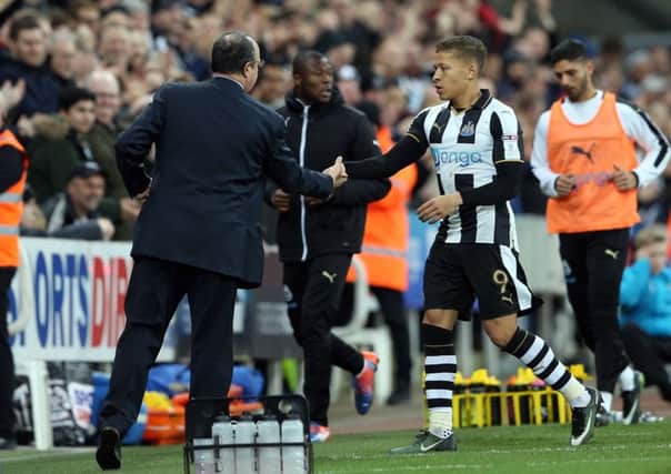 Newcastle United's manager Rafael Benitez shakes hands with Dwight Gayle.