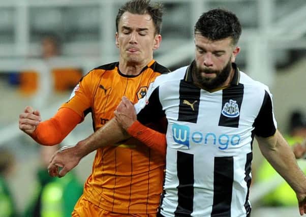 Newcastle defender Grant Hanley battles against Wolves earlier in the season