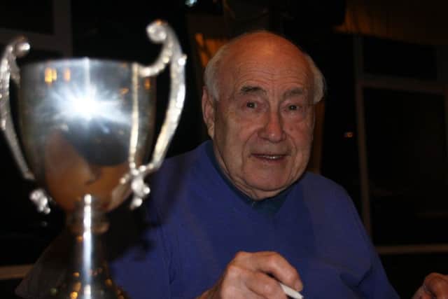 Ron Young organiser of Houghton Rotary Club's sport night with the winners trophy.