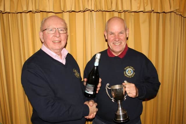 Houghton Rotary President Ashley Burland (left) with Len Aitchison, the sports winner.