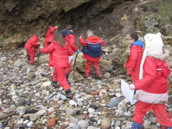 Year 3 and 4 pupils from Seascape School go in search of Blackbeard's black stone heart at the Barn in Easington.