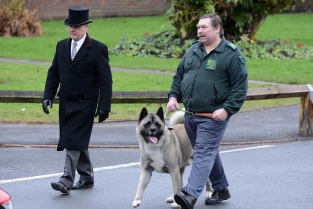 The funeral procession led by Michael's dog Simba.