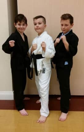 Eastlea Karate Club black belts Shay Lamond,  Lyndon Bishop and Kaylem Little.