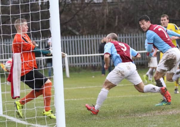 Gavin Cogdon heads in South Shields' second goal against Chester-le-Street . Image by Peter Talbot.